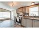 Charming kitchen features stainless steel appliances and mosaic backsplash at 611 Victor Pl, Shelbyville, IN 46176
