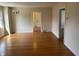 Bright living room featuring hardwood floors and an open doorway at 6186 Ralston Ave, Indianapolis, IN 46220