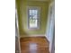 Bright room features hardwood floors, fresh paint, and natural light at 6186 Ralston Ave, Indianapolis, IN 46220