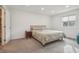 Well lit bedroom with carpet and view of the outdoors at 622 Conner Creek Dr, Fishers, IN 46038