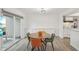Well-lit dining area adjacent to the kitchen, featuring built-in storage at 622 Conner Creek Dr, Fishers, IN 46038