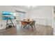 Modern dining room with a table, chairs, TV and access to the outdoor patio at 622 Conner Creek Dr, Fishers, IN 46038