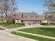 Inviting townhome with a well-maintained lawn, attached garages, and stone facade at 622 Conner Creek Dr, Fishers, IN 46038