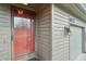 Close-up of the front door, exterior light, and house number on a townhome at 622 Conner Creek Dr, Fishers, IN 46038