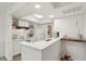 Bright kitchen with white cabinets, modern appliances, and ample counter space at 622 Conner Creek Dr, Fishers, IN 46038