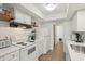 Bright kitchen with white cabinets and modern appliances at 622 Conner Creek Dr, Fishers, IN 46038