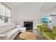 Bright and airy living room featuring a fireplace, comfortable seating, and modern decor at 622 Conner Creek Dr, Fishers, IN 46038