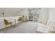 Sunlit living room with walkout patio, sofa, and chairs at 622 Conner Creek Dr, Fishers, IN 46038