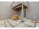 Outdoor patio features a dining table with four chairs and a view of the yard at 622 Conner Creek Dr, Fishers, IN 46038