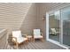 Wooden patio with outdoor seating and sliding glass door at 622 Conner Creek Dr, Fishers, IN 46038
