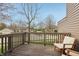 Wooden patio with outdoor seating and a view of neighborhood at 622 Conner Creek Dr, Fishers, IN 46038