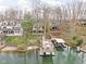 Stunning aerial view of lakefront homes with private docks and boat slips surrounded by mature trees at 6948 Eagle Dr, Nineveh, IN 46164