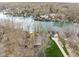 Expansive aerial view of lake community with lakefront houses and manicured lawns on a gray spring day at 6948 Eagle Dr, Nineveh, IN 46164