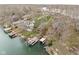 Aerial view of the lakefront property showcasing docks, mature trees, and water access at 6948 Eagle Dr, Nineveh, IN 46164