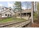 Spacious backyard featuring a large deck and a picturesque view of the surrounding greenery at 6948 Eagle Dr, Nineveh, IN 46164