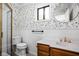 Vintage bathroom with floral wallpaper, updated fixtures, and wainscoting for a classic look at 6948 Eagle Dr, Nineveh, IN 46164
