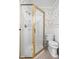 Traditional bathroom features a glass enclosed shower stall with gold trim and floral wallpaper at 6948 Eagle Dr, Nineveh, IN 46164