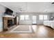 Spacious main bedroom with stone fireplace, light-colored walls, and multiple windows at 6948 Eagle Dr, Nineveh, IN 46164