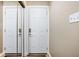Clean entryway featuring a mirror, coat closet, and neutral wall paint at 6948 Eagle Dr, Nineveh, IN 46164