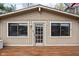 Charming exterior with a wood door and large windows, offering plenty of natural light at 6948 Eagle Dr, Nineveh, IN 46164