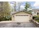 Neutral siding garage with white door and black accents; metal roof is also visible from this angle at 6948 Eagle Dr, Nineveh, IN 46164