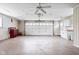 Spacious garage with epoxy flooring, ample storage, and a large door for easy access at 6948 Eagle Dr, Nineveh, IN 46164