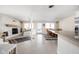 Cozy living room with a fireplace, tile flooring, a dining area, and white furniture at 6948 Eagle Dr, Nineveh, IN 46164