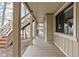 Exterior image showing a porch and wooden stairs, with a glimpse of the waterfront at 6948 Eagle Dr, Nineveh, IN 46164