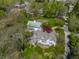 Charming home with a barn and lush greenery, viewed from above showcasing its idyllic setting at 7124 Purdy St, Indianapolis, IN 46268