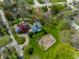 Overhead shot of the residence and the surrounding manicured lawn, trees, and landscape at 7124 Purdy St, Indianapolis, IN 46268