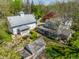 Aerial view of the home, barn, chicken coop and surrounding landscaping at 7124 Purdy St, Indianapolis, IN 46268