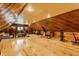 Spacious attic with wood paneled walls, ceiling and flooring, and work-out equipment at 7124 Purdy St, Indianapolis, IN 46268