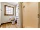 Charming bathroom with wood-look flooring, a pedestal sink, and a separate shower stall at 7124 Purdy St, Indianapolis, IN 46268