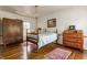 Calming bedroom with hardwood floors, neutral decor, and bright natural light at 7124 Purdy St, Indianapolis, IN 46268
