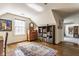 Bright bedroom with hardwood floors, a decorative rug, and ample natural light from a large window at 7124 Purdy St, Indianapolis, IN 46268