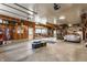 Spacious garage with wood paneling, ample storage, and a classic BMW parked inside at 7124 Purdy St, Indianapolis, IN 46268