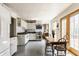Cozy kitchen area with eat in breakfast table and access to the back yard through a glass door at 7124 Purdy St, Indianapolis, IN 46268