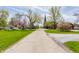 Scenic street view with flowering trees leading to a church, creating a serene and inviting atmosphere at 7124 Purdy St, Indianapolis, IN 46268