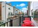Balcony with red table and chairs overlooks other homes, creating a cozy outdoor space at 741 Bates St, Indianapolis, IN 46202