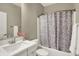 Well-maintained bathroom with ample counter space and tub with shower at 741 Bates St, Indianapolis, IN 46202