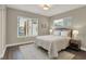 Well-lit bedroom boasts a large window, cozy rug, and stylish nightstand at 741 Bates St, Indianapolis, IN 46202