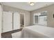 Bright bedroom featuring a large window, closet with barn doors, and ensuite bathroom at 741 Bates St, Indianapolis, IN 46202