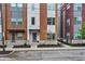 Attractive townhome exterior with brick and siding, well-maintained landscaping, and a welcoming entrance at 741 Bates St, Indianapolis, IN 46202