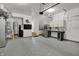 Spacious garage with epoxy flooring, utility sink, and ample storage solutions, ideal for organization at 741 Bates St, Indianapolis, IN 46202