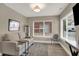Bright living room featuring a comfortable sofa, large windows, and a modern, minimalist design at 741 Bates St, Indianapolis, IN 46202