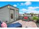Cozy rooftop deck featuring comfortable seating, vibrant plants, and a trendy outdoor rug, perfect for relaxing at 741 Bates St, Indianapolis, IN 46202