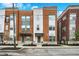 Charming townhomes with brick and siding exteriors and well-maintained landscaping along the street at 741 Bates St, Indianapolis, IN 46202