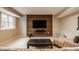 Finished basement with modern entertainment center and comfortable seating area, perfect for relaxation at 7613 W Stonegate Dr, Zionsville, IN 46077