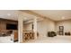 Basement living area featuring a wood accent wall, comfortable seating, and entertainment options at 7613 W Stonegate Dr, Zionsville, IN 46077
