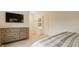 Neutral bedroom design features a dresser and a bed, offering a simple yet functional space for rest and relaxation at 7613 W Stonegate Dr, Zionsville, IN 46077